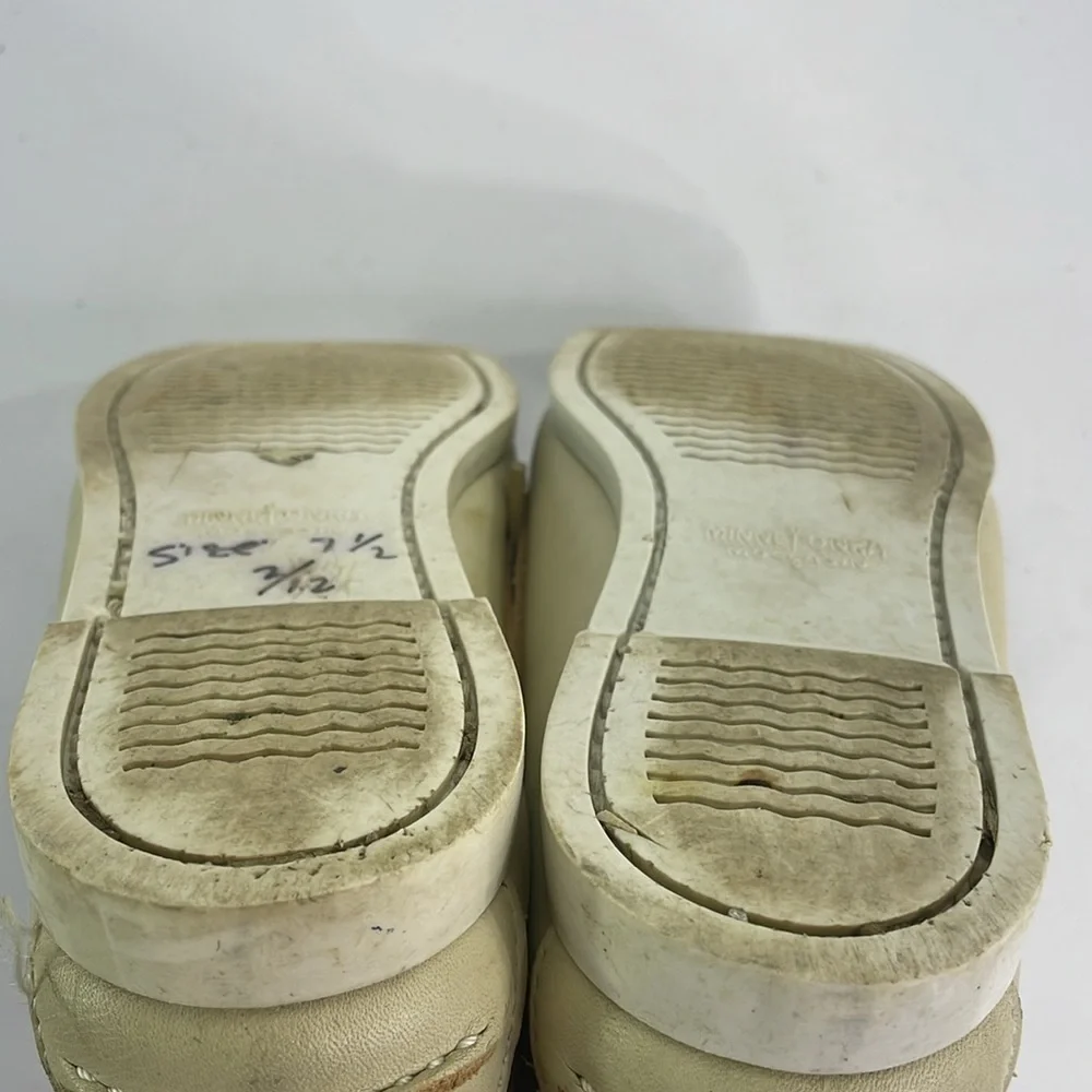 Minnetonka cream leather boat shoes, white sole